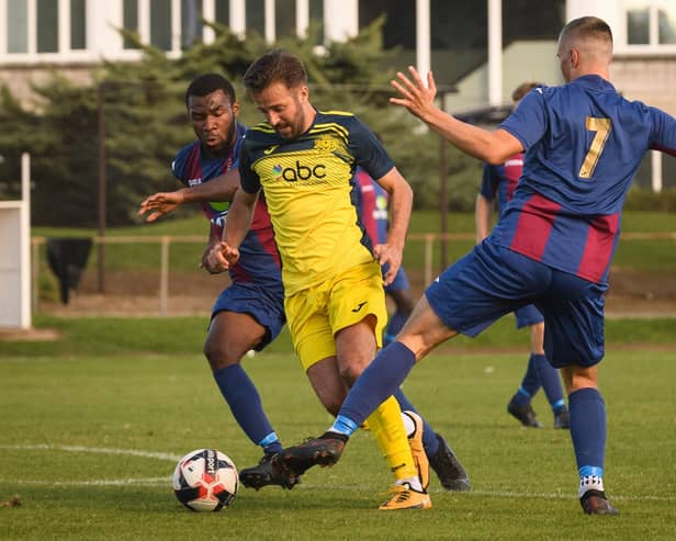 Moneyfields' Dec Seiden (yellow) has joined Portsea Island neighbours Baffins Milton Rovers. Picture: Keith Woodland
