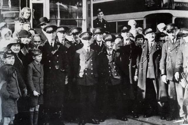 The last tram to run in Portsmouth in 1936 arriving at Eastney depot with the crews and spectators gathered around.