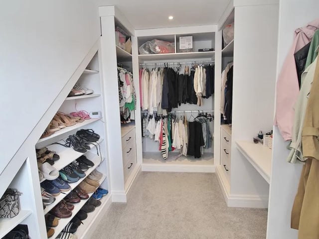 This property comes with 2 dressing rooms, a utility room and a huge open-plan kitchen.