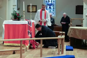 Alan Mak MP lays a wreath during the Remembrance Sunday service held at St James' Church, Emsworth