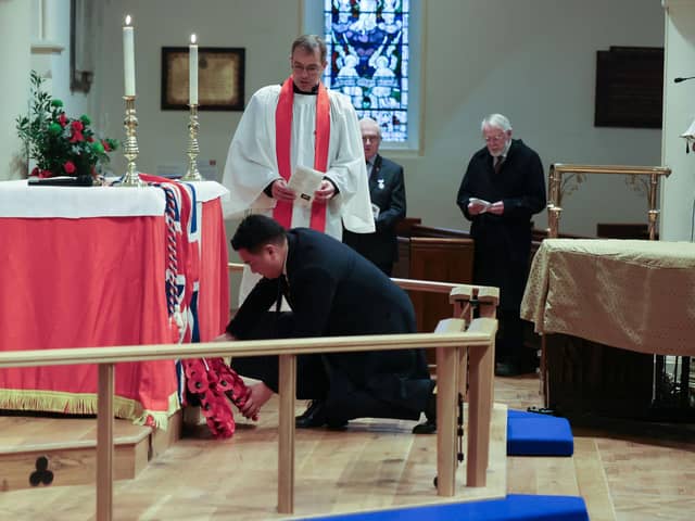 Alan Mak MP lays a wreath during the Remembrance Sunday service held at St James' Church, Emsworth