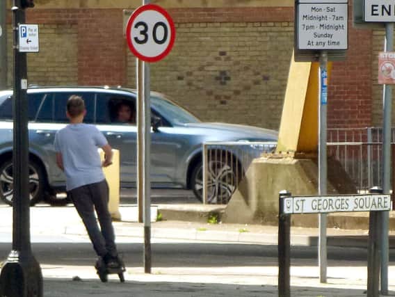 Concerns have been raised about 'dangerous' used of illegal private e-scooters in Portsmouth.
Pictured: A boy on an e-scooter in August 2020 captured near Gunwharf Quays in Portsmouth.