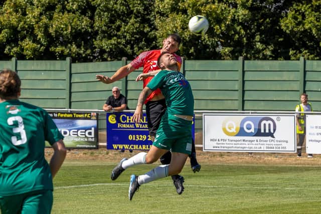 Fareham's Garry Moody  wins this aerial challenge against Hythe & Dibden. Picture: Mike Cooter