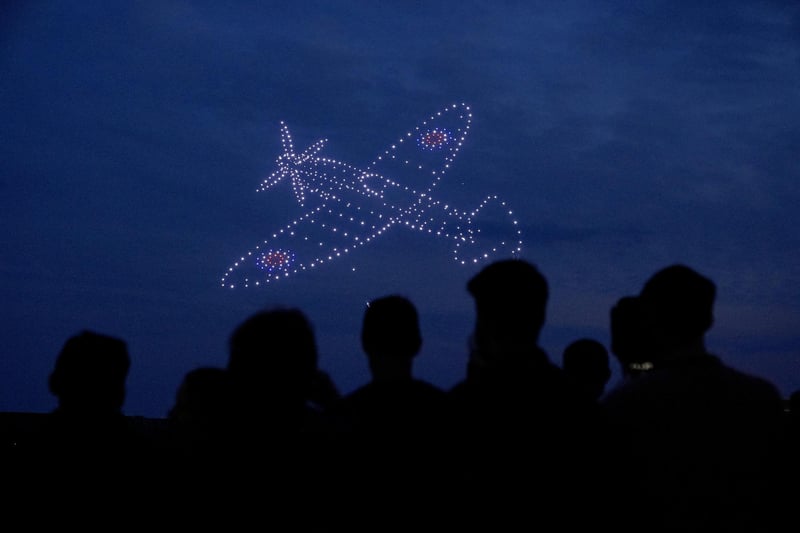 Drones make a Spitfire during a drone display telling the story of D-Day. Photo: Andrew Matthews/PA Wire