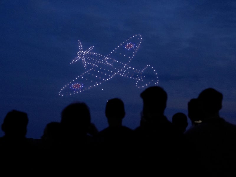 Drones make a Spitfire during a drone display telling the story of D-Day. Photo: Andrew Matthews/PA Wire