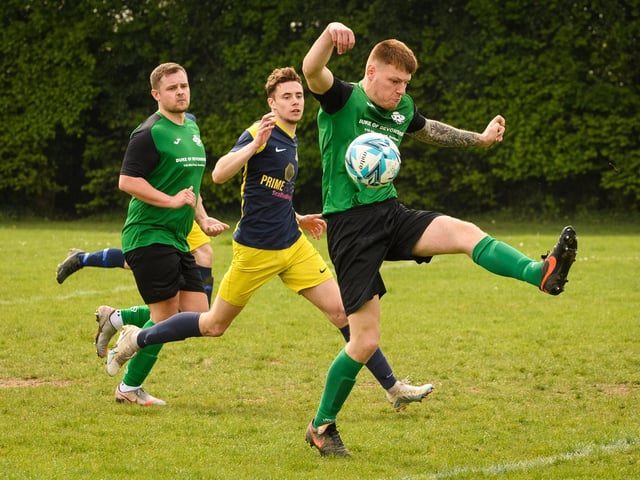 Action from Saturn Royale's 1-0 win over Pelham Arms (blue and yellow kit) in the second Adelaide Cup semi-final. Picture: Keith Woodland (300421-497)