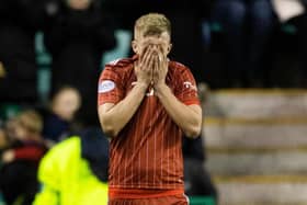 Aberdeen's Ross McCrorie is dejected following a 6-0 defeat at the hands of Hibernian this weekend, costing boss Jim Goodwin his job. Picture: Craig Williamson/SNS Group