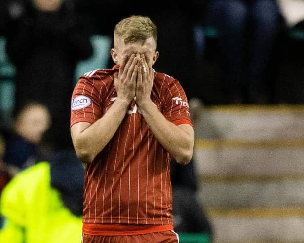 Aberdeen's Ross McCrorie is dejected following a 6-0 defeat at the hands of Hibernian this weekend, costing boss Jim Goodwin his job. Picture: Craig Williamson/SNS Group