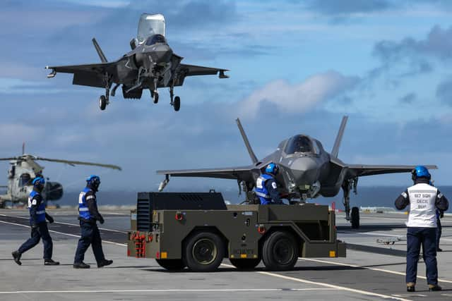 Pictured: F35B Lightening Jets return to HMS Queen Elizabeth after a trianing flight.