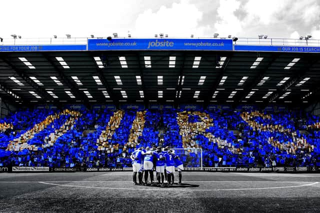 Pompey fans spell out Ours in the Fratton End on opening day of the 2013-14 season against Oxford. Picture: Joe Pepler