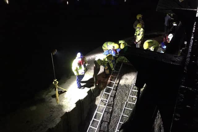 Emergency crews rescuing the lady