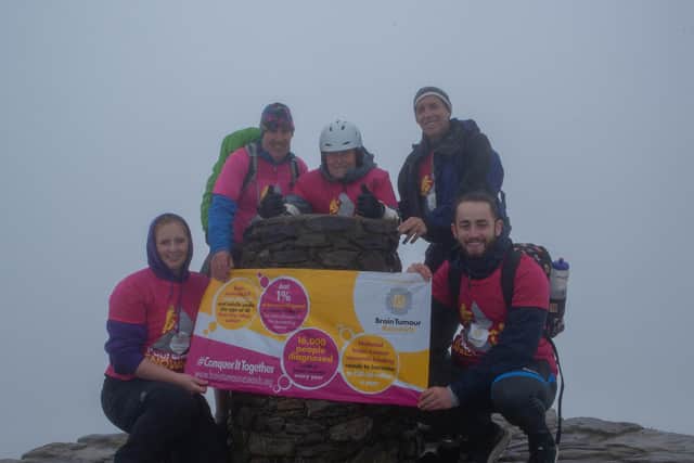 Parapalegic Paul Smith from Cosham with his team on the summit of Mount Snowdon.
Pictured: Karen Morling, Sean Broderick, Paul Smith, Alan Smith and Steve-Lee Robinson.
Credit: Karen Morling
