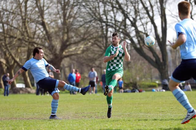 Portchester's Max Winslade, left, in action against Mob Albion. Picture: Chris Moorhouse