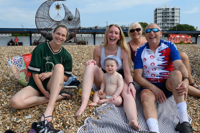 Pictured is: A happy family enjoying their day out on the beach.