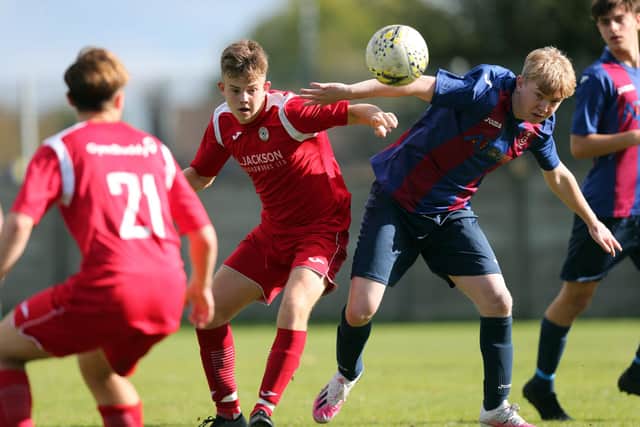 McKenzie Morgan, second left, impressed for youthful Horndean in their Wessex League Cup loss at Amesbury. Picture: Chris Moorhouse