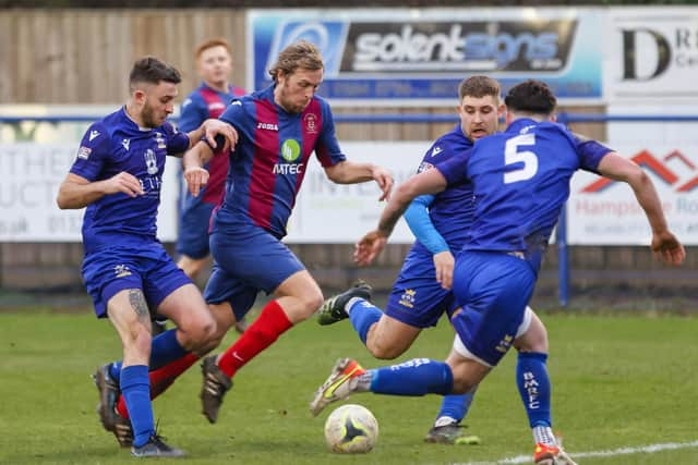 Simon Woods, centre, is available for US Portsmouth after being cup-tied in midweek