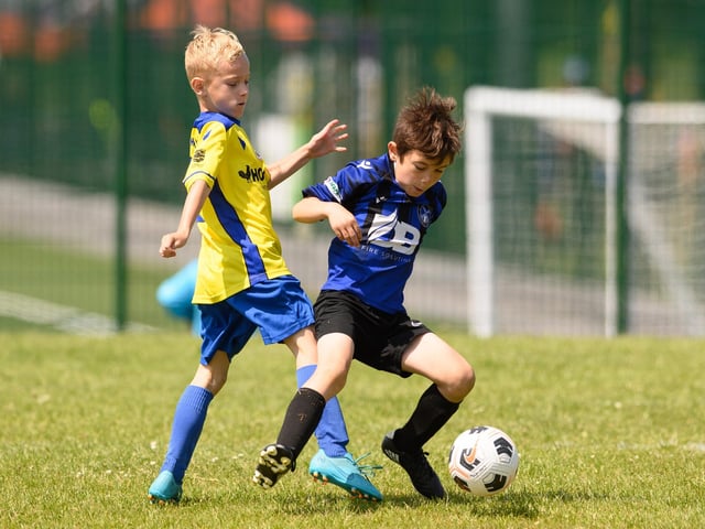 Action from the Clanfield youth football tournament at Horndean Technology College. Picture: Keith Woodland (270521-703)