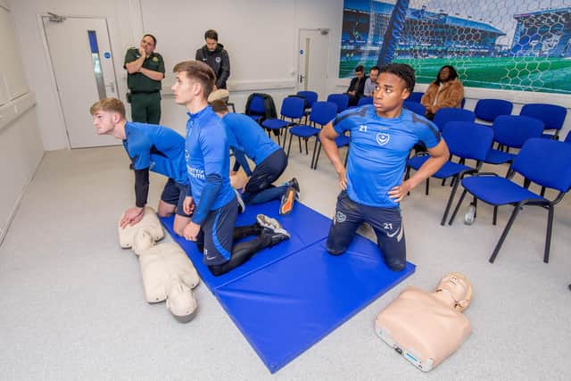 Pompey players practise CPR Picture: Habibur Rahman