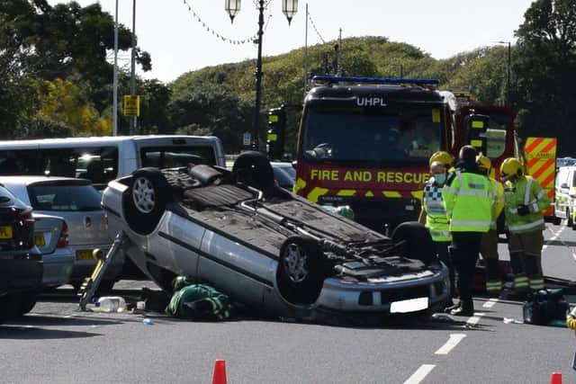 A car has overturned in a crash in South Parade, Southsea, on July 29, 2021. Picture: Stuart Vaizey

