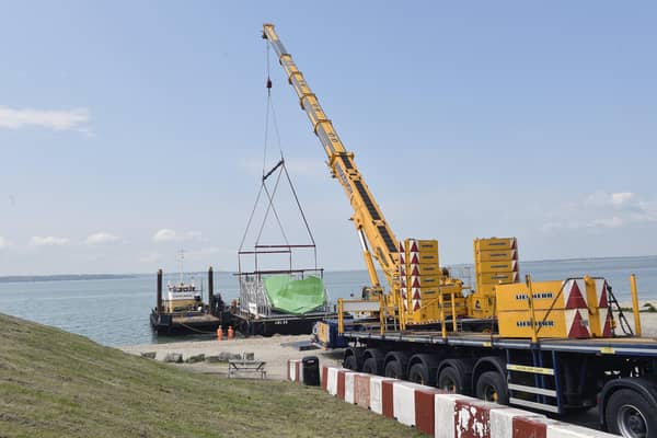 A mould for Sunseeker was craned onto a barge at Lee-on-the-Solent slipway on Friday, May 19. Picture: Sarah Standing (190523-4308)