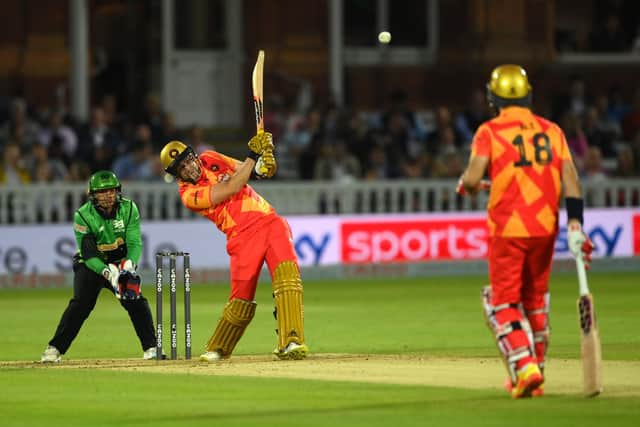 Phoenix batter Liam Livingstone hits out watched by Alex Davies  during The Hundred Final. Photo by Stu Forster/Getty Images.