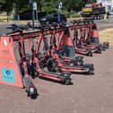 Voi e-scooters at a parking station in Southsea.