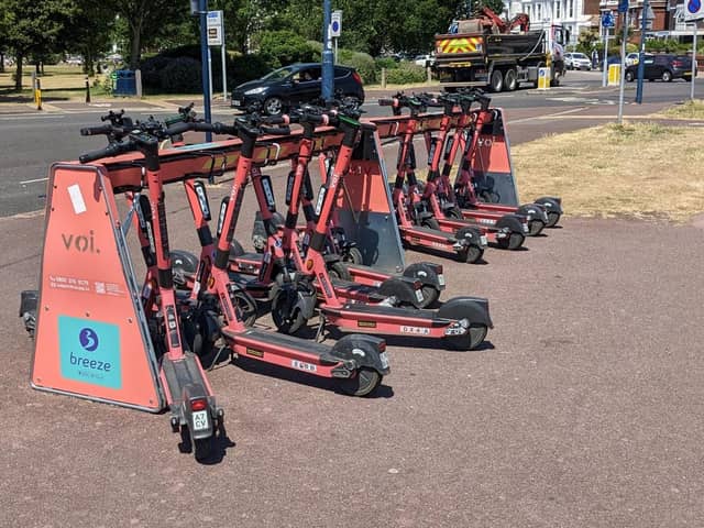 Voi e-scooters at a parking station in Southsea.