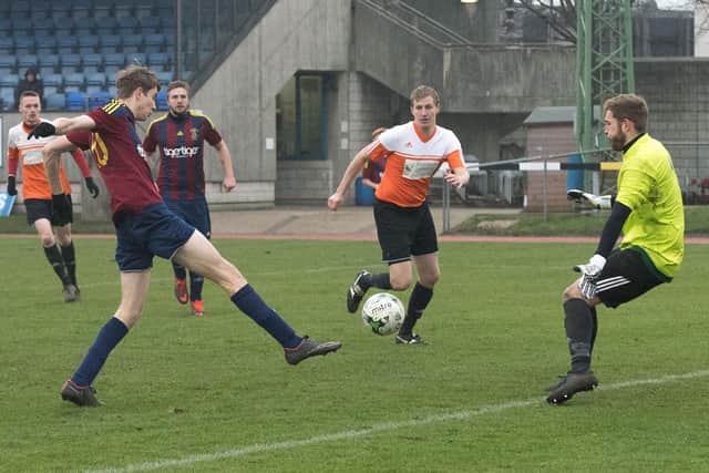 Harry Jackson, left, in Wessex League Division 1 action for US Portsmouth against East Cowes. Picture: Keith Woodland
