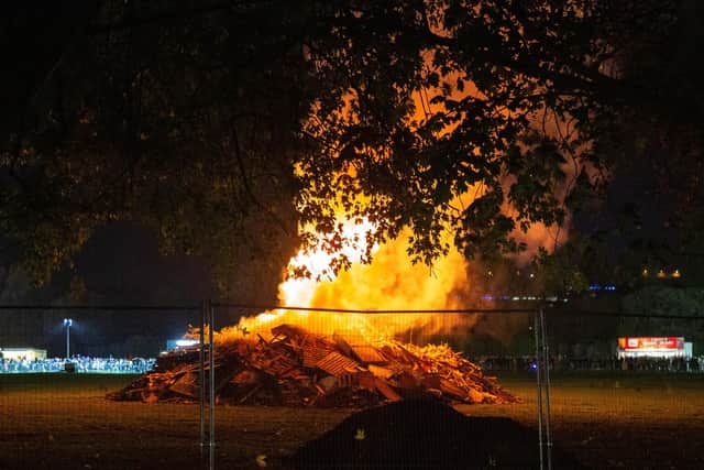 Cosham Bonfire and Fireworks Displayat King George V Playing Field, Cosham, Portsmouth on Wednesday 3rd November 2021Pictured:Bonfire being litPicture: Habibur Rahman