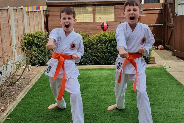 Karate kids Mark Hague, 10, left, and brother Myles nine, throwing out one of their punches. Photo: Pauline Hague