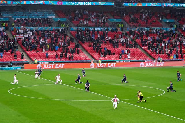 England and Scotland players take a knee ahead of the UEFA Euro 2020 Group D match at Wembley Stadium, London, Friday June 18, 2021. Picture by Mike Egerton/PA Wire.