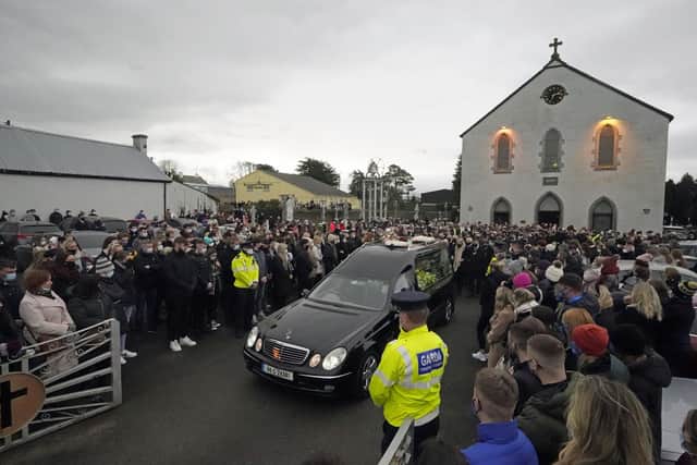 Ashling Murphy's family and mourners walk behind the hearse as it leaves St Brigid's Church, Mountbolus, Co Offaly. Picture: Niall Carson/PA Wire