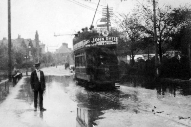 Clarendon Road in flood. In the first third of the last century we see a packed tram travelling east along a flooded Clarendon Road, Southsea. Picture: Barry Cox collection