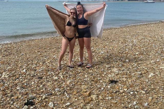 Mia Elias and Lottie Parker taking part in University of Portsmouth Sailing Club's 'Take a Dip.'