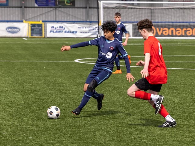 Action from the Under-14 Memorial Challenge Cup final between Pickwick Youth Pumas (all blue kit) and Horndean Youth Red. Picture: Mike Cooter