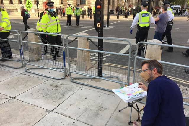 Kevin Dean painting at the Extinction Rebellion (XR) protest in London, summer 2020.