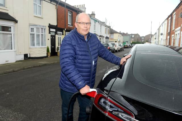 The installation of Portsmouth's first on-street electric vehicle charge point took place on Friday, March 8, in Adair Road, Southsea.Pictured is: Glen Arnold, charging up his electric car in Adair Road, Southsea.Picture: Sarah Standing (080319-1487)