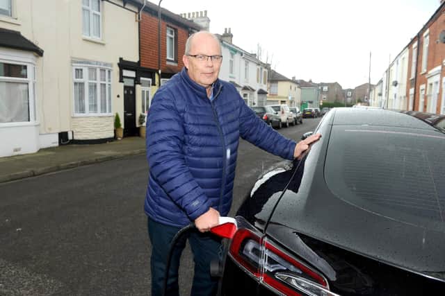 The installation of Portsmouth's first on-street electric vehicle charge point took place on Friday, March 8, in Adair Road, Southsea.

Pictured is: Glen Arnold, charging up his electric car in Adair Road, Southsea.

Picture: Sarah Standing (080319-1487)