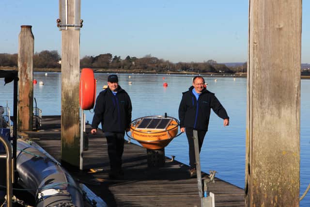 Paul Evans and Professor Dave Cooper with the buoy.
