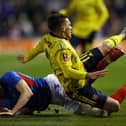Arsenal's Lucas Torreira is tackled by Pompey defender James Bolton.  Picture: Richard Heathcote/Getty Images
