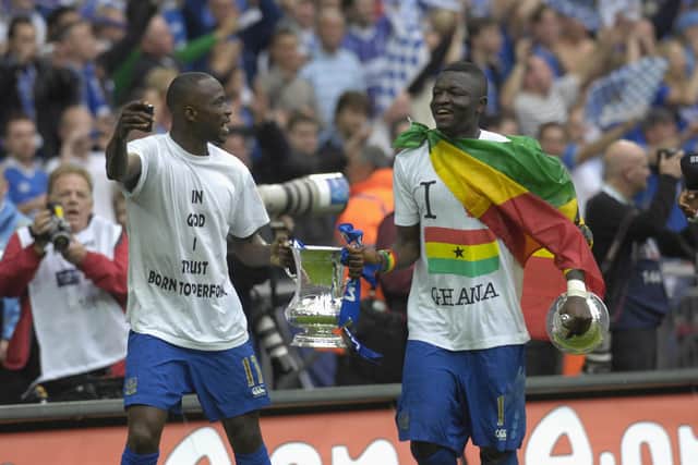 Sulley Muntari (right) parades the FA Cup with Pompey team-mate John Utaka following their May 2008 Wembley triumph. Picture: Will Caddy