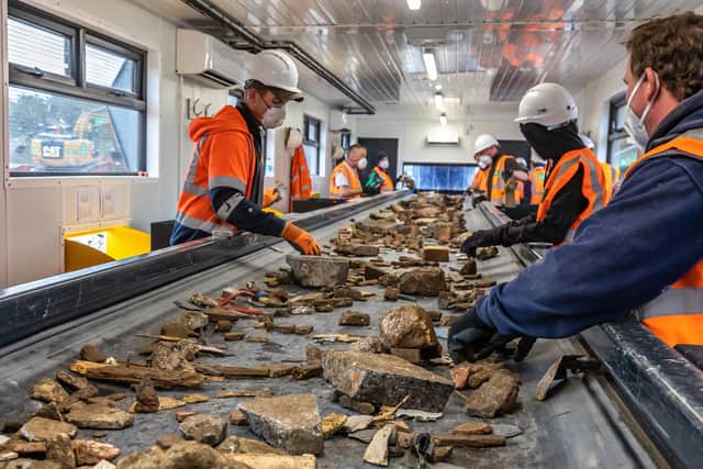 Incoming waste is carefully inspected and graded by the team of workers. Picture: Mike Cooter (151021)