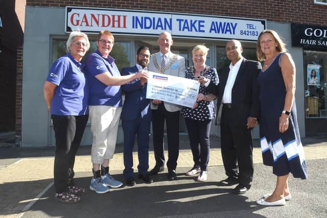 From left, Jayne Bowater, volunteer chair for Relay for Life Portsmouth, Sarah Porter, volunteer survivorship chair for Relay for Life Portsmouth, Abu Suyeb-Tanzam, owner of Gandhi Indian Take Away, The Mayor and Mayoress of Fareham Mike and Anne Ford, Abu's business partner Mosud Ahmed and Cllr. Tina Ellis for Fareham West.
Picture: Sarah Standing (200622-676)