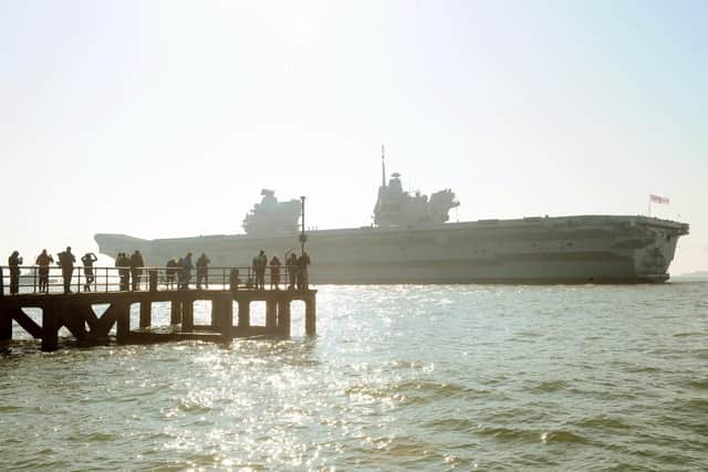 HMS Queen Elizabeth leaving Portsmouth on Monday, March 1.Picture: Sarah Standing (010321-3964)