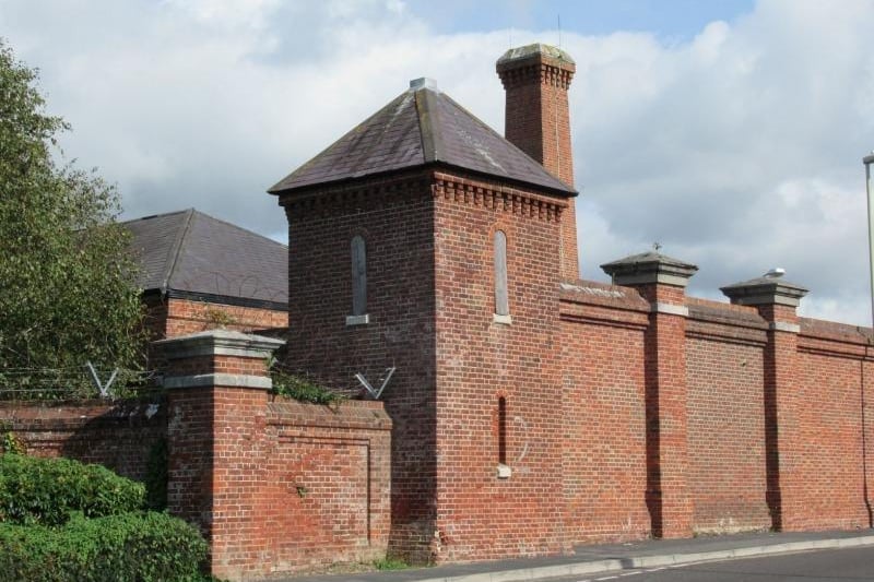 The mid C19 boundary walls incorporating corner watchtowers, walkways and gates which are mainly built of red brick laid in Flemish bond with stone dressings and pyramidal slate roofs to watch towers. Historic England say it is at risk due to animal burrowing, defective roofs, eroding brickwork and pointing, missing windows and doors and vegetation growth. Historic England says contact with a local construction college has been established who will supervise brickwork repairs at the site to develop heritage skills.
