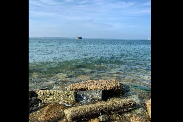The rock groynes of Southsea seafront are visible as the Solent looks clear and clean during lockdown.
