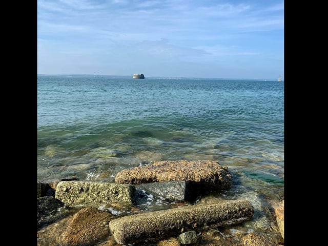 The rock groynes of Southsea seafront are visible as the Solent looks clear and clean during lockdown.