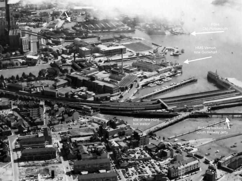 Portsmouth harbour station and HMS Vernon. A view over Portsmouth Harbour station towards HMS Vernon and Portsmouth power station in 1952.