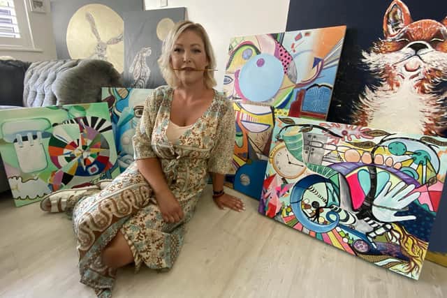 Karina Vaile, a Warblington artist with a rare condition called Charcot-Marie-Tooth and often has to use her mouth to paint, has been donating paintings to hospitals and care homes including Queen Alexandra Hospital