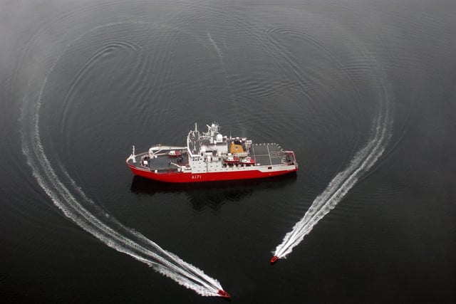 HMS Endurance at anchor in Port Lockroy, Antarctica, with her two seaboats creating a heart around the ship using their wakes whilst the ships company are mustered on the McGreggor hatch in the form of two kisses.  Image was set up for Valentine's Day in February 2006. Picture: LA(Phot) Matt Ellison/Royal Navy